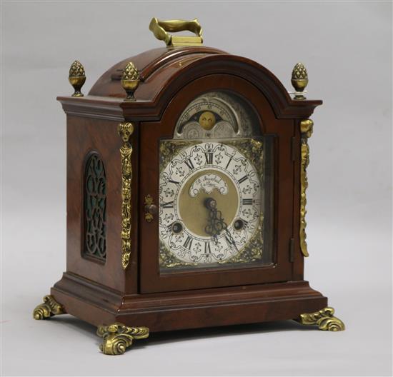 A walnut and brass mounted mantel clock 26cm.